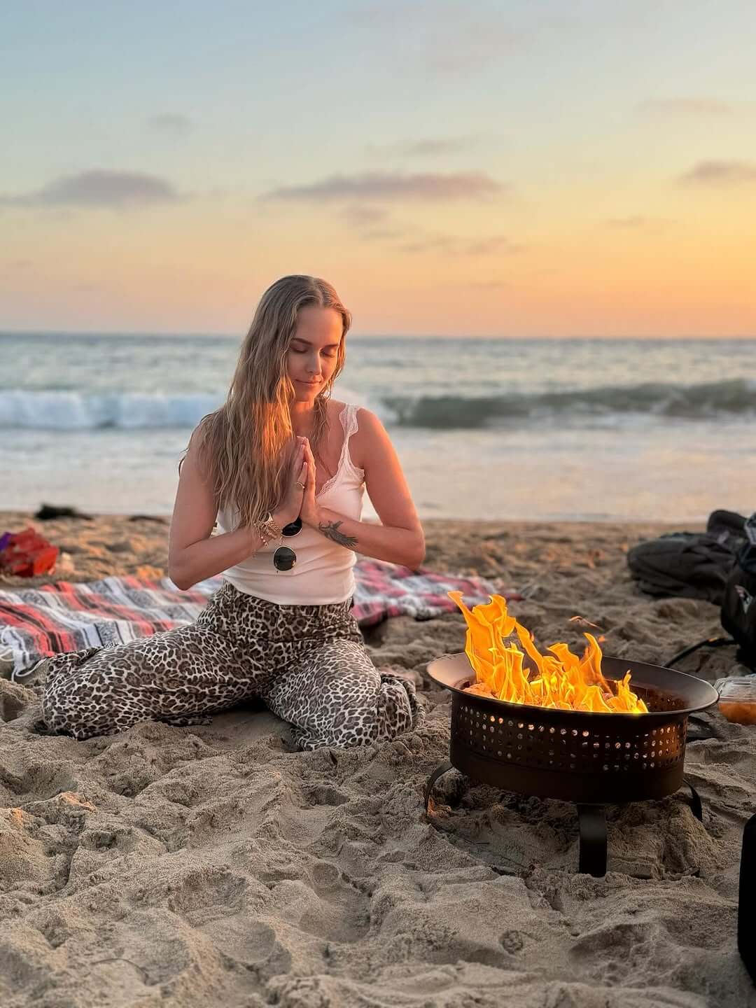 A hand holding a flame